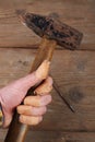 Carpenter hand fingers and hammer