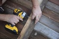 Carpenter hand and power drill Royalty Free Stock Photo