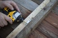 Carpenter hand and power drill Royalty Free Stock Photo