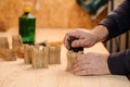 Carpenter hands polishing wood with sandpaper Royalty Free Stock Photo