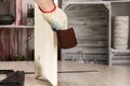 Carpenter hands polishing wooden planks with a sandpaper. Concept of DIY woodwork and furniture making Royalty Free Stock Photo