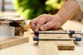 Carpenter hands at work with clamp Royalty Free Stock Photo