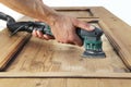 Carpenter work the wood with the sander Royalty Free Stock Photo