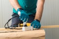 Carpenter handyman plugging electric handy saw Royalty Free Stock Photo