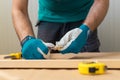 Carpenter handyman sharpening pencil with pocket knife