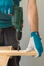 Carpenter handyman using electric drill Royalty Free Stock Photo