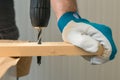 Carpenter handyman using electric drill Royalty Free Stock Photo