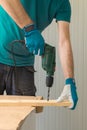 Carpenter handyman using electric drill Royalty Free Stock Photo