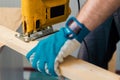 Carpenter handyman using electric handy saw Royalty Free Stock Photo