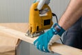 Carpenter handyman using electric handy saw Royalty Free Stock Photo