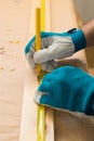 Carpenter handyman using pencil to mark the plank Royalty Free Stock Photo