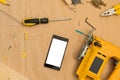 Carpenter handyman workshop desk tabletop with samrt phone