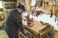 Carpenter at his professional woodworking bench