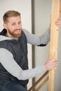 Carpenter holding length wood
