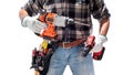 Carpenter holding rechargeable hammer drill and the rechargeable screwdriver, isolated on white background. Work safety