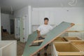 Carpenter installing cabinets a laminate counter top in a kitchen Royalty Free Stock Photo