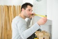 Carpenter installing luxury fitted kitchen Royalty Free Stock Photo