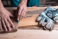 Carpenter, joiner at work in the workshop. Man at work on wood