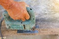 Carpenter or joiner working with electric saw - closeup on hands,Carpenter on nature,Carpenter in thailand,Carpenter in asia Royalty Free Stock Photo