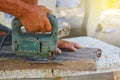 Carpenter or joiner working with electric saw - closeup on hands,Carpenter on nature,Carpenter in thailand,Carpenter in asia Royalty Free Stock Photo