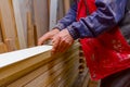 Carpenter lines up the glued wooden profiles in carpentry, preparing them for clamping