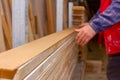 Carpenter lines up the glued wooden profiles in carpentry, preparing them for clamping