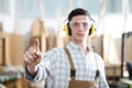 Carpenter man touch screen in carpentry background Royalty Free Stock Photo