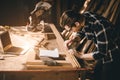 Carpenter man Wood worker working hand made furniture in shop factory industry. male wooden craftsman builder working in workshop Royalty Free Stock Photo