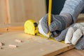 Carpenter marking pine wood plank for cutting Royalty Free Stock Photo