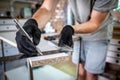 The carpenter marks the piece of wood with a pen and ruler Royalty Free Stock Photo