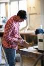 Carpenter measures the board thickness of the callipers, joiner'