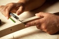 Carpenter measuring chair part with electric callipers. Royalty Free Stock Photo