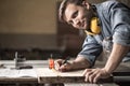 Carpenter measuring wooden board