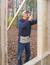 Carpenter nailing plywood sheathing Royalty Free Stock Photo