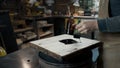 A carpenter paints a piece of wood for a loft-style chair with a brush. Close up