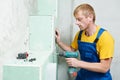 Carpenter with plasterboard and screwdriver Royalty Free Stock Photo