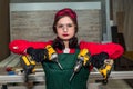 Carpenter posing with drill machines, woodworker - woman Royalty Free Stock Photo