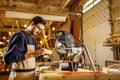 Carpenter preparing wooden furniture for customers, work on an order