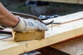 Carpenter pulling a nail from a plank using Claw hammer Royalty Free Stock Photo