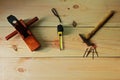 Carpenter`s for woodworking. Old Hammer and nail and wood plane and Measuring tape on texture wooden background Royalty Free Stock Photo