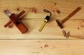 Carpenter`s for woodworking. Old Hammer and nail and wood plane and Measuring tape on texture wooden background Royalty Free Stock Photo