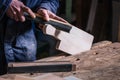 Carpenter sanding piece of Timber with sandpaper Royalty Free Stock Photo