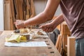 Carpenter sanding wood in the carpentry Royalty Free Stock Photo