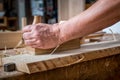 Carpenter sanding wood in the carpentry Royalty Free Stock Photo