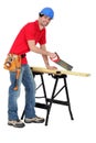 Carpenter sawing Royalty Free Stock Photo