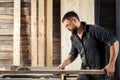 Carpenter sawing board Royalty Free Stock Photo
