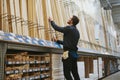 Carpenter selecting lengths of cut wood Royalty Free Stock Photo