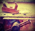 Vice and plate on work bench with vintage effect Royalty Free Stock Photo