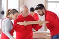 carpenter showing apprentices wood piece Royalty Free Stock Photo