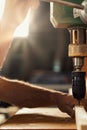 Carpenter skillfully operates drill press Royalty Free Stock Photo